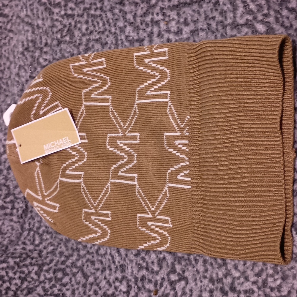 Michael Kors hat. NWT. Brown and White letters. Stylish. Flawless